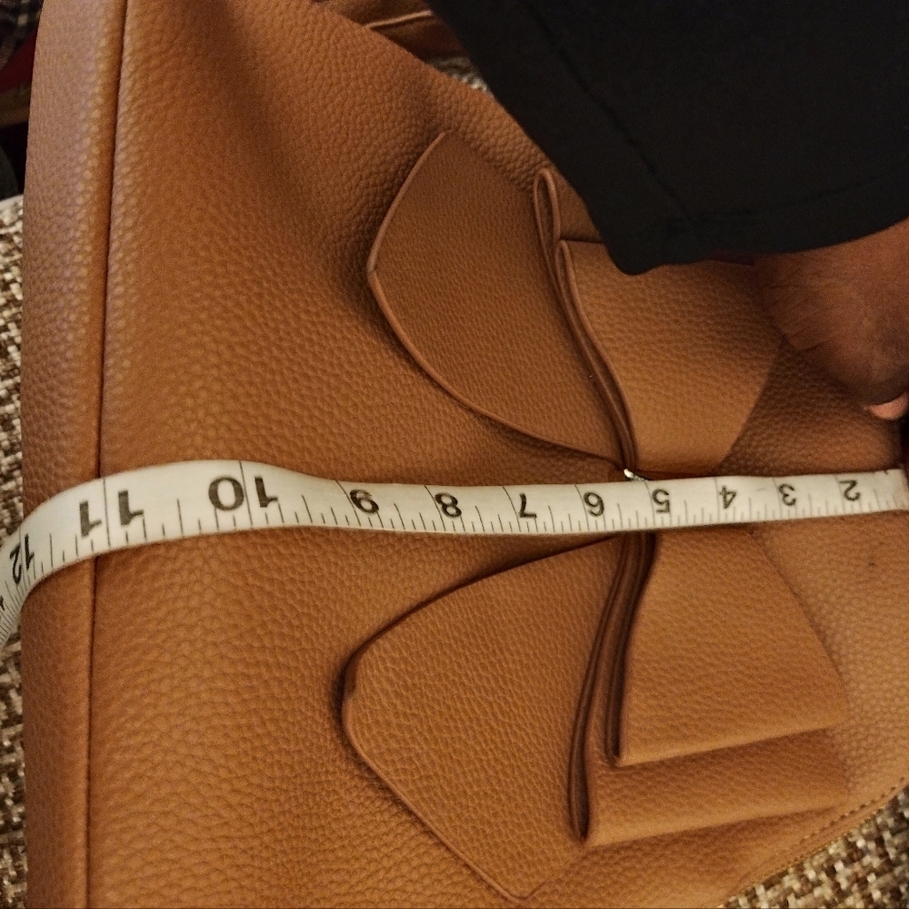 Crossi women's tan bow mini back pack w/ adjustable straps and interior pockets - Picture 12 of 12